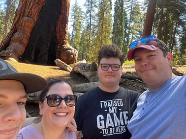 Jesse, Shaina, David, and Jason selfie in front of a sycamore