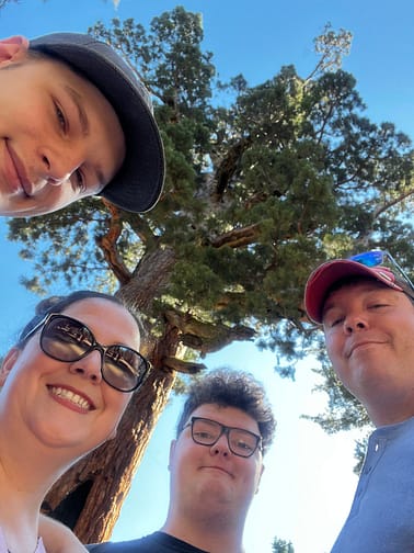 Jesse, Shaina, David, and Jason selfie in front of a sycamore